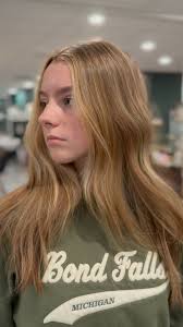 Enhanced this beauty by brightening some of her natural color with soft  blonde hilites throughout to create that dreamy sun kissed hair.