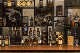 A Shelf For Every Size Bottle The Whisky Shop Manchester Uk Whisky Shop Retail Design Blog Resort Design