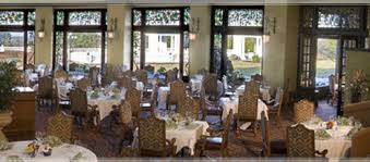 Dining room features a black french dining table with light brown chairs, loop armchair, atop dark wooden floors, in front of a window, all illuminated by a circular ceiling lamp. Circular Dining Room The Hotel Hershey Picture Of The Circular Hershey Tripadvisor