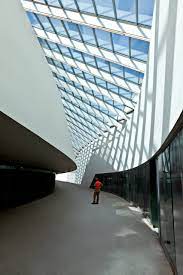 The Body Of The Space Is Formed From Ribs Of Steel While Its Walls Are Clad In Panels Of Solid Surfac Zaha Hadid Architects Zaha Hadid Zaha Hadid Architecture