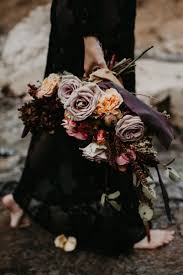 A bouquet with a long ribbon is a seriously stunning look, and more and more brides are adopting this idea as they plan their wedding day. Haley Truck Desert Elopement Utah Elopement Florist Wedding Bridal Flowers Bouquets Arrangements Pleasant Grove Ut Dark Wedding Bridal Flowers Fall Wedding Flowers