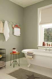 Pale Muted Greens Make For A Serene Bathroom Space Try Overtly Olive On Bathroom Walls With Splashes Of Brig Green Bathroom Serene Bathroom Painting Bathroom