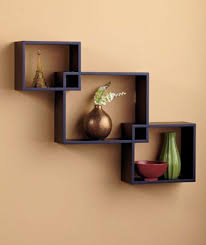 Just as suitable for displaying photos and collectibles as it is for storing household or other items, this shelf is strong and sturdy and has a white laminate surface that resists staining. Set Of 3 Interlocking Black Wall Shelves Wall Display Home Decor Black Interlocking Wall Shelves Display Shelf Wall Shelves Design Wall Shelf Decor Shelf Decor