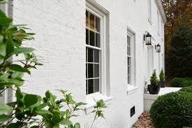 Painting a surface as rough and porous as brick is much more involved than just painting a house with stucco or wood siding. Painting Our Brick House White Young House Love