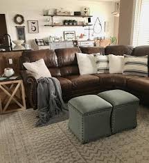 Warm grey walls, brown couches and furniture with teal throw pillows and accents with touches of plum and white to give it a little crisp. Elaziz Elz 2308 Area Rug Brown Leather Couch Living Room Leather Couch Living Room Decor Leather Couches Living Room