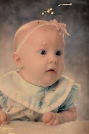 Hi, at my new job we have a board with the team's baby photos. I'd love to  use this one but the physical photo is full of scratches and discoloration.  Is anyone