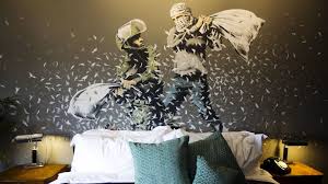 An armed palestinian policeman stands before 'the armoured dove', a graffiti painting by banksy depicting a peace click though the gallery above to see a selection of banksy's works in palestine. Banksy Decorates West Bank Hotel With Views Of Israel S Wall Bbc News