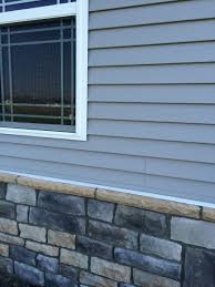 Where brick siding extends only partway up the wall, the top of the brick may be finished with a rowlock course, a masonry cap or wood trim to transition to a different siding material. Questioning Siding To Stone Transition Exterior Inspections Internachi Forum