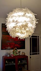 a simple affordable and beautiful diy feather lampshade feather lamp paper lampshade ikea lamp
