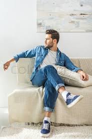 Good morning and welcome to a very cool, cool roundabout. Young Attractive Man Sitting On Sofa At Stock Image Colourbox