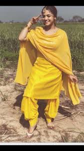 Black And Yellow Suit Girls Yellow Punjabi Suit With Golden Work Complimented With Punjabi Jutti For All Women Who Love Suit Indian Fashion Saree Trendy Outfits Punjabi Outfits