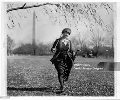 Winifred Mason Huck Carrying Golf Clubs and Bag News Photo