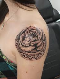 A dark rose that sits firmly on top of the shoulder. 165 Shoulder Tattoos To Die For