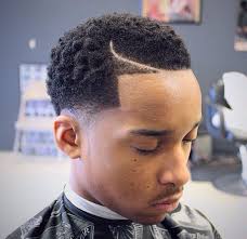 If you have a talented barber or hair stylist, then your imagination is the only limit when it comes to hair designs. Tapered Number 2 Haircut Black Man Novocom Top