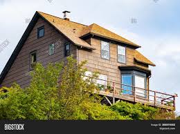 It install flashing around any chimneys, vent pipes or other openings, again matching the flashing to the roofing material. Traditional Charming Image Photo Free Trial Bigstock