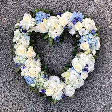 For such occasions relatives usually order various ritual flowers, such as mourning flowers, funeral wreaths, and casket sprays for decorating the coffin. Evans Ocean Breeze Small Open Funeral Heart In Peabody Ma Evans Flowers