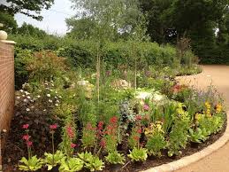 Find landscaping and garden ideas, including water features, fences, gates, flowers and plants. Planting A Large Front Garden Flower Bed Landscape Garden Designers Reading Berkshire Pete Sims