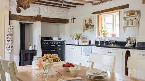 White kitchen ideas (photos) colonial remodel in white with light wood above is a remodeled kitchen done in mostly white with natural light wood floors and wood island surface. Traditional White Kitchen Ideas Country