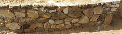 Look for stones that are at least twice as large as your hands clasped together. How To Build A Simple Cheap Garden Retaining Wall