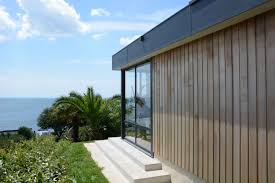 Extension Maison Toit Plat Vue Sur Mer Avec Un Bardage Bois Www Verandaline Com Extension Maison Maison Maison Toit Plat