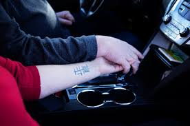 Close up hand holding something like a bottle or can isolated on white background with clipping path. Holding Hands While Driving This Whole Life