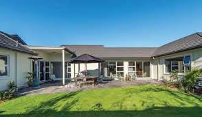 Spacious windows fill the home with light, while the earth floors, earth plaster and earthbags provide thermal mass to store excess heat, thus providing an. U Shape Gives Home X Factor Nz Metal Roofing Manufacturers