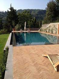infinity swimming pool with waterfall infinity swimming pool indalo piscine cascade piscine piscine a debordement piscine amenagement paysager