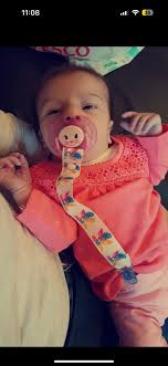 Hi all, this is my daughter who was called home to heaven at 4 months old  Could anyone possibly take 1 of these photos and make her look like an  angel with