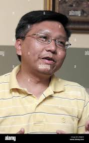 ADVANCE FOR WEEKEND EDITIONS OCT. 11-12 ** Khoan Tran, is seen at his home,  Wednesday, Oct. 1, 2008 in Newtown, Conn. Earlier this year, Tran wrote his  life story out, the