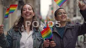 LGBTQ LGBT lesbian same sex couple walki... | Stock Video | Pond5