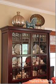 Learn how to take your home from blah to bananas. Living Room Makeover On A Budget China Cabinet Decor Top Of Cabinet Decor Country Kitchen Decor