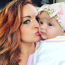 WWE Diva Maria Kanellis Bennett giving a kiss to her three-month-old  daughter Freddie Moon Bennett. #WWE #TotalDivas #wwefamilies #wwekids