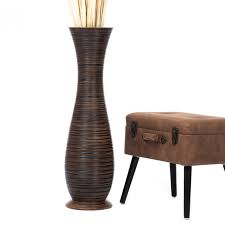 I got two of these in different styles for placing to either side of a fireplace. Leewadee Tall Big Floor Standing Vase For Home Decor 36 Inches Mango Wood Brown
