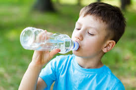 Kids drinking from water fountain. Getting Kids To Drink More Water