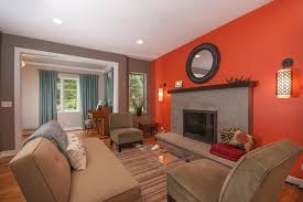 The upholstery and carpet's neutral colors also serve as a background to make the orange accent pieces pop. Decorating The Living Room Furniture With Wall Accents Burnt Orange Living Room Living Room Orange Accent Walls In Living Room
