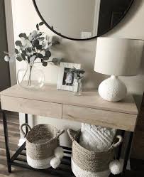 The Case And Flowers In 2020 Hallway Table Decor Entryway Console Table Home Living Room