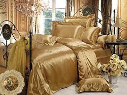 The paris gold set includes a comforter, two shams, two euro shams, two decorative pillows and a bed skirt. 11 Luxurious Gold Bedding Sets