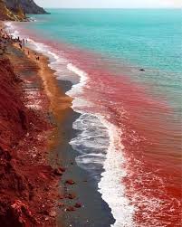 Red floods at Hormuz Island's red beach