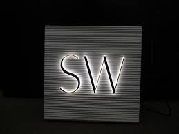 Acrylic Channel Letters On Corian Texture Panel Channel Letters Light Letters Retail Signage