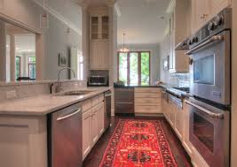 White Kitchen White Cabinets White Countertops White Quartz Turkish Rug Wood Floors Stainless Stee White Countertops Narrow Kitchen Interior Architecture