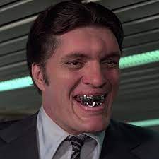 A set of stainless steel teeth in his mouth. Jaws Richard Kiel James Bond Wiki Fandom