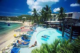The Couple Is Enjoying Their Time At The Bolongo Bay Beach Resort In St Thomas All Inclusive Resorts Family Beach Resorts Virgin Islands Vacation