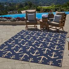 All the furniture is anchored to the rug, with parts on and parts of the rug. Naples Indoor Outdoor Rug Collection Anchors Costco