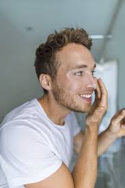 Man Putting Under Eye Cream