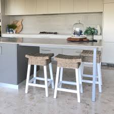 Inspired by daydreams of tropical breezes, this rattan barstool transforms any interior into an exotic oasis. Denver White Wood Rattan Barstool Humble Home