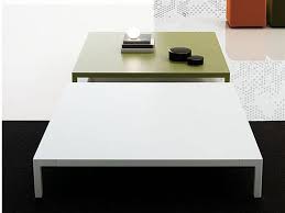 Table top features book matched veneer on metal base. 10 Modern Coffee Tables
