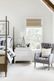 Getting a good night's sleep doesn't have to be complicated. Brown Wood 4 Poster Bed With Black And White Bedding Transitional Bedroom