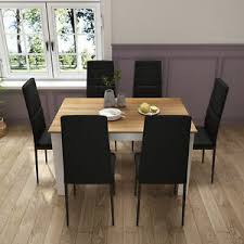It gives it a rich feeling and looks beautiful when set for holidays. Wooden Dining Table Oak With 6 Black Faux Leather Chairs Kitchen Furniture Set Ebay