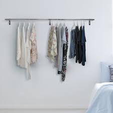Lighting fixtures with led lamps can be clicked into the rail at any spot to illuminate your wall decorations. Wall Mounted Clothes Hanging Rail 2400mm Displaysense