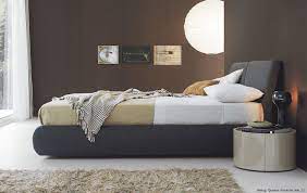 Bett mit stoff kopfteil und bettwasche bild kaufen 12998497 living4media. Designer Polsterbett Bambo Stoff
